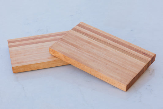 Experience the allure of our large hardwood cutting board. Expertly crafted from hard maple and hickory, this exquisite gift measures approximately 17"x10.5"x1.5". Combining beauty and functionality, it's the perfect present for culinary adventurers.