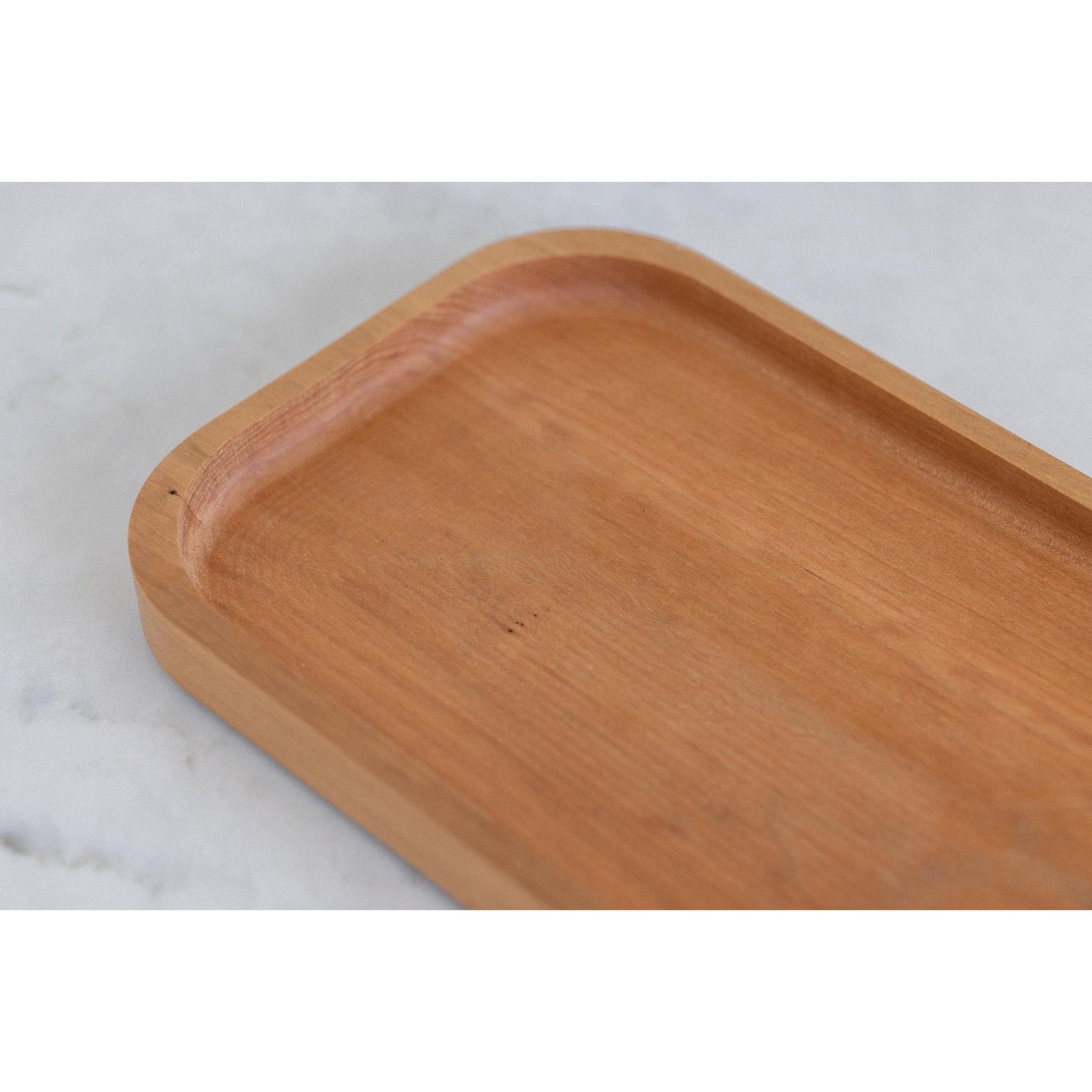 Surprise your husband or boyfriend with our hardwood valet tray, a cherry catch-all that organizes their desk. This 7"x11"x3/4" masterpiece is a practical and stylish gift, keeping their essentials organized in style at the workspace.