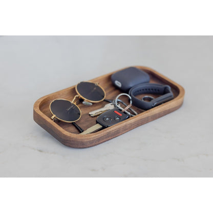 Surprise your husband or boyfriend with our hardwood valet tray, a cherry catch-all that organizes their desk. This 7"x11"x3/4" masterpiece is a practical and stylish gift, keeping their essentials organized in style at the workspace.