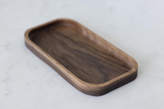 Exquisite Hardwood Valet Tray, crafted from walnut wood. Versatile organizer keeps essentials in one place with style. Perfect gift for husbands or boyfriends. Measures 5"x10"x3/4". Combines functionality and elegance. Felt feet protect wood.